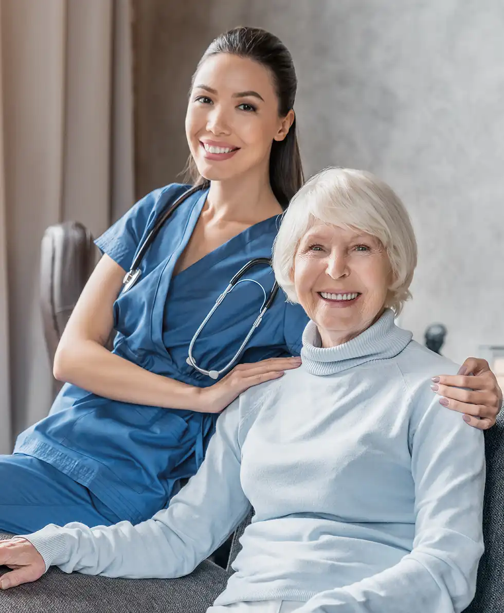 Physical therapist helping a patient exercise at home